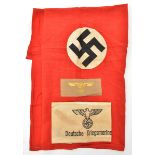 A small Third Reich double sided flag, 25” x 29”, with small applied swastika on both sides; a black