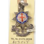 An officer’s enamelled “Sterling” cap badge of The R Sussex Regt, by J R Gaunt London, 2 screw