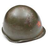 A Soviet Russian steel helmet, the front with red star transfer badge, and with padded lining and