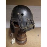 A WWII American tank crew fibre and leather helmet, with flaps for earphones. GC (worn and
