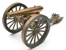 A well detailed brass and wooden scale model of a 25 shot cannon, 5x5 small bores with lift out