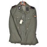 A Third Reich SS man’s 4 pocket tunic, the right hand lining stamped with SS runes and “BW” in