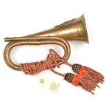 A brass and copper bugle, with applied A&S Highlanders badge, coloured cords and tassels. GC (