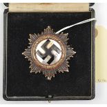 A Third Reich German Cross in gold, of heavy 10 rivet construction with maker’s mark “1” on the