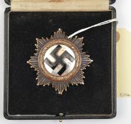 A Third Reich German Cross in gold, of heavy 10 rivet construction with maker’s mark “1” on the