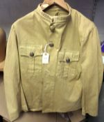 A collarless lightweight khaki jacket, 2 pockets to chest, 5 Vic General Service buttons to chest,