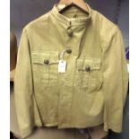 A collarless lightweight khaki jacket, 2 pockets to chest, 5 Vic General Service buttons to chest,