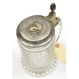 A glass tankard, the pewter lid mounted with a WM death’s head badge and engraved “Meine Ehre