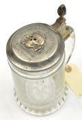 A glass tankard, the pewter lid mounted with a WM death’s head badge and engraved “Meine Ehre
