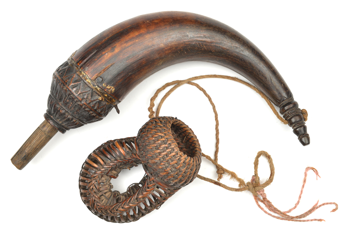 A Cambodian powder horn. Probably 19th century, 26cms, swollen top carved with lotus leaves, - Image 2 of 3