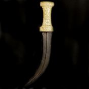 A Persian dagger khanjar. Mid 19th century, curved DE watered steel blade 24cms with raised