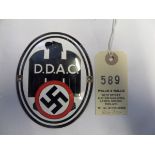 A Third Reich D.D.A.C. (Die Deutsche Automobil Club) nickel plated and enamelled oval plaque, 4” x