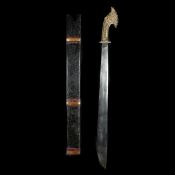 An Indonesian sword parang. 20th century, broad SE blade 61.5cms swollen towards the tip, cast brass