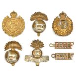 5 cap badges: Geo V RE voided and non voided, R Munster Fus (2) and pair RMF titles, R. Dublin