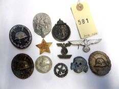 11 various Third Reich badges etc: SS grey metal cap skull; black wound badge (pin hook missing);