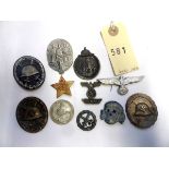 11 various Third Reich badges etc: SS grey metal cap skull; black wound badge (pin hook missing);