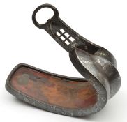 A Japanese iron stirrup abumi. 19th century, of conventional form inlaid overall with silver
