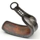 A Japanese iron stirrup abumi. 19th century, of conventional form inlaid overall with silver