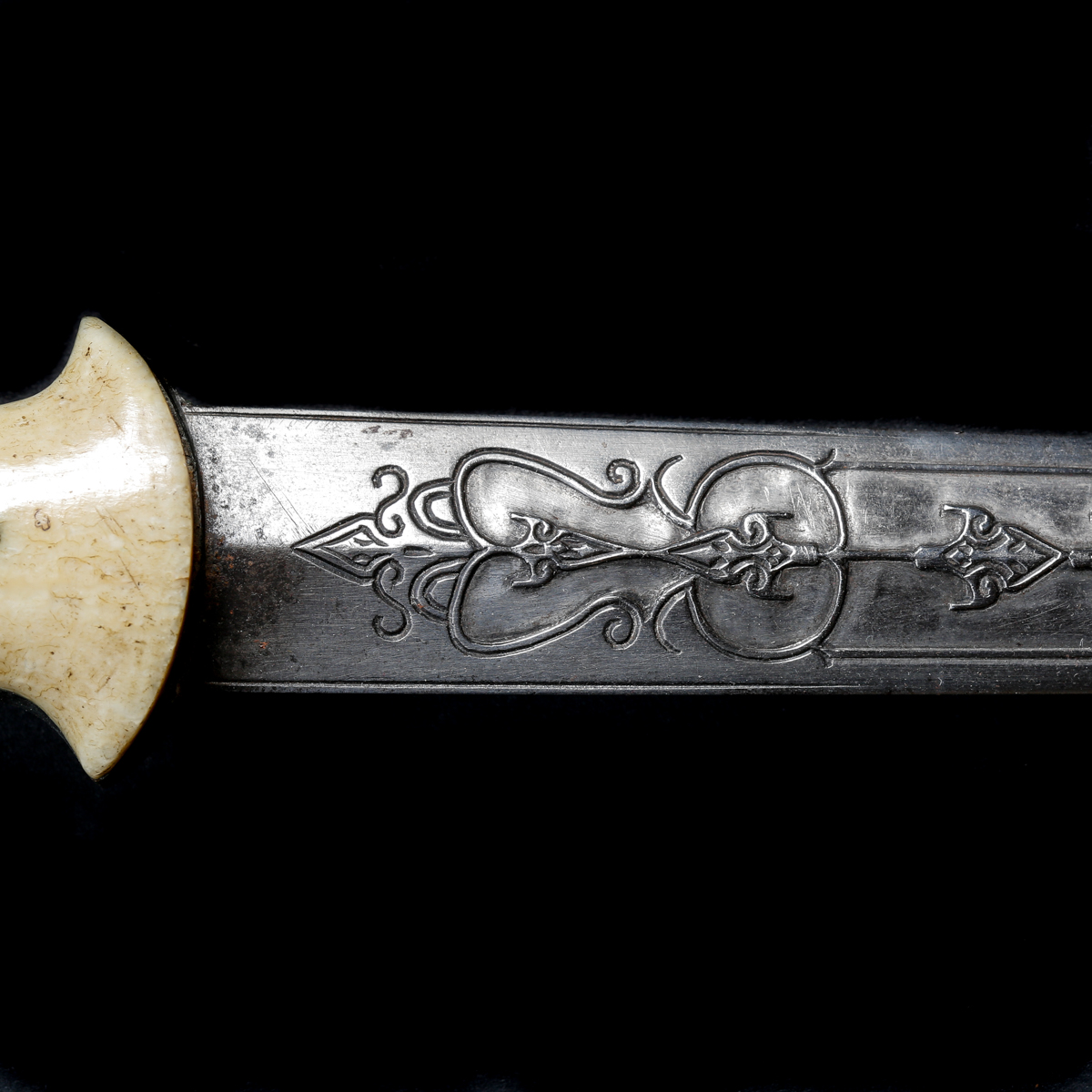 A Bosnian dagger. 19th century, straight tapered DE blade 36.5cms chiselled with geometric ornament, - Image 3 of 3