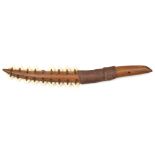 A Kingsmill (Gilbert) Islander's dagger tebutje. 31cms, comprising tiger shark's teeth (one missing)