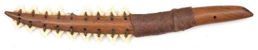 A Kingsmill (Gilbert) Islander's dagger tebutje. 31cms, comprising tiger shark's teeth (one missing)