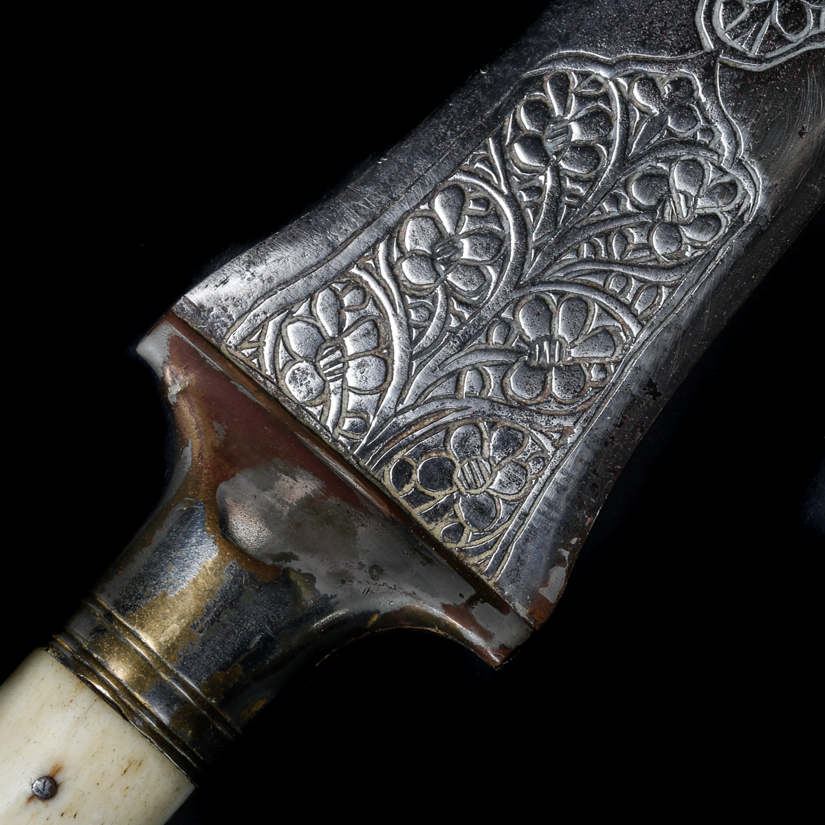 An North Indian dagger. Late 19th century, broad straight DE blade 30.5cms chiselled with flowers, - Image 3 of 3