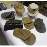 7 various German ski type caps, 3 side caps, and 2 officers caps, with various Third Reich insignia,