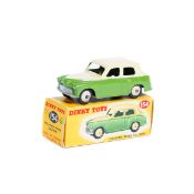 Dinky Toys Hillman Minx Saloon (154). An example in two-tone cream and light green with cream ridged