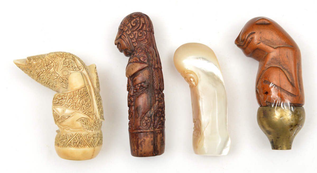 4 assorted kris hilts. Comprising 2 from Sumatra, the first made from hippo tusk and carved with a