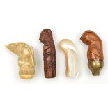 4 assorted kris hilts. Comprising 2 from Sumatra, the first made from hippo tusk and carved with a