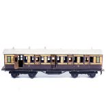 A Bing for Bassett-Lowke Gauge One tinplate GWR bogie coach. Full First class, in lined brown and