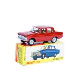 A French Dinky Toys Moskvitch (1410). In red oxide red with cream interior, dished spun wheels and