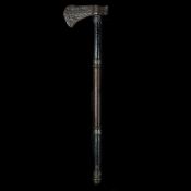 An Indian axe tabarzin. 18th century iron head14.5cms in excavated condition, on later wooden haft