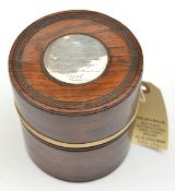 A turned darkwood cylindrical tobacco box, silver coloured disc, 1-7/8”, in lid, engraved “Tobacco