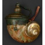 A decorative Indian powder flask. Made from a turbo shell, 14cms, large stepped copper top with