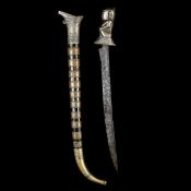 A Batak short sword from Sumatra. 20th century, swollen SE blade 37.5cms, cast pale brass hilt in