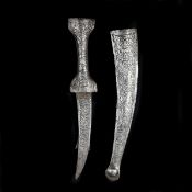 A Persian dagger jambiya. Twin sprung blades 19.5cms enclosing a fixed shorter central barbed blade,
