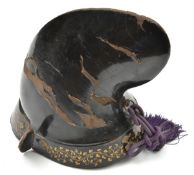 A Japanese black lacquered harikake parade helmet kabuto. in the form of a courtier's hat (naga-