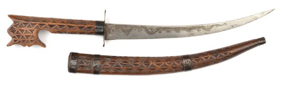 A North African dagger nimcha. Early 20th century, curved SE blade 26cms engraved and with a