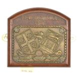 A cast brass rectangular badge of HMS Carlisle, cruiser 1918-49, showing the Arms of Carlisle and