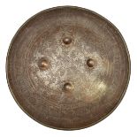 A Persian steel shield dhal. Qjar dynasty, 45cms diameter, fitted with 4 central bosses and etched