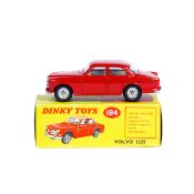 Dinky Toys Volvo 122S (184). Example in bright red with white interior, dished spun wheels with