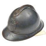 A scarce WWI Czech Legion “Adrian” pattern steel helmet, with grey/blue finish, pressed steel badge,