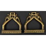 A pair of South Indian cast brass hollow stirrups. Probably 19th century, each bow engraved and