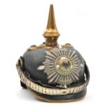 A Prussian Garde officer’s pickelhaube, with enamelled Garde star plate, brass mounts which would