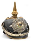 A Prussian Garde officer’s pickelhaube, with enamelled Garde star plate, brass mounts which would
