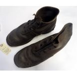 A pair of WWI German leather ankle boots, with iron bound toes and heels and hob nail soles, the