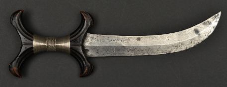 An African (Sudanese) Hadendoa tribal knife. c1900, broad curved DE blade 21.5cms, black hardwood