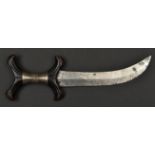 An African (Sudanese) Hadendoa tribal knife. c1900, broad curved DE blade 21.5cms, black hardwood