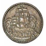 A cast brass circular badge of HMS Neptune, battleship 1909-1922, depicting the original fully